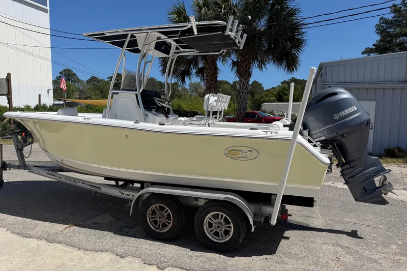 Slide: The Image of 2017 Sea Hunt Triton 210 boat on trailer with Yamaha outboard motor. - 5