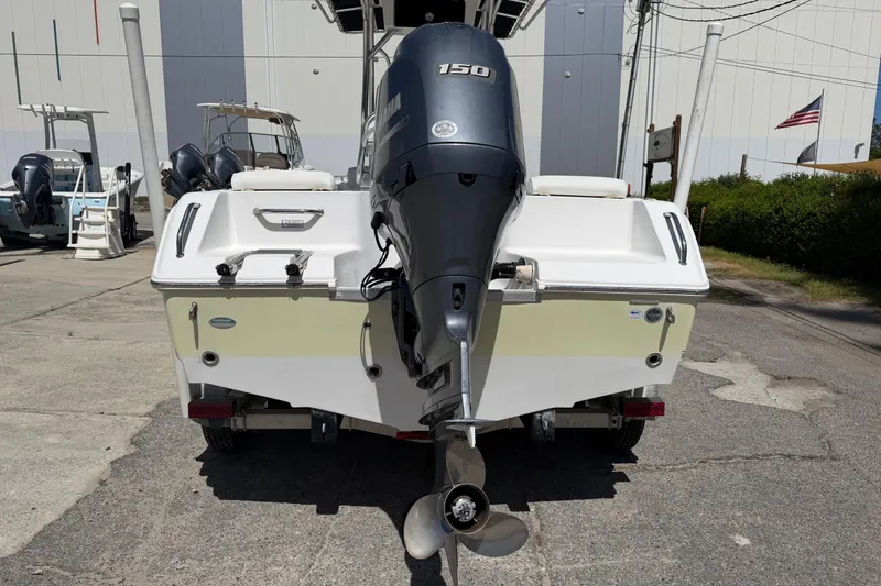 Slide: The Image of Rear view of a 2017 Sea Hunt Triton 210 boat with Yamaha 150 outboard motor. - 6