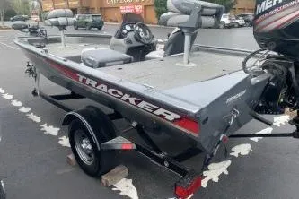Slide: The Image of 2016 Tracker Pro Team 175 TF boat with trailer in parking lot. - 3