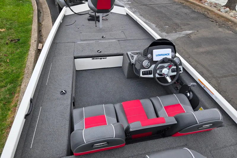 Slide: The Image of 2018 Ranger RT188C boat interior with steering wheel and seating, featuring Lowrance electronics. - 10