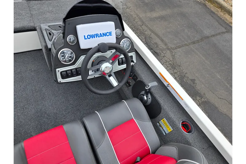 Slide: The Image of 2018 Ranger RT188C boat dashboard with Lowrance display and red-gray seating. - 11