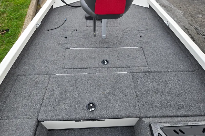 Slide: The Image of 2018 Ranger RT188C boat interior with gray carpet and red seat. - 14