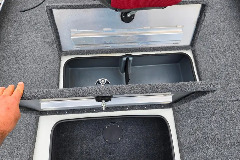 Slide: The Image of 2018 Ranger RT188C boat storage compartment with open lid, revealing interior space. - 15