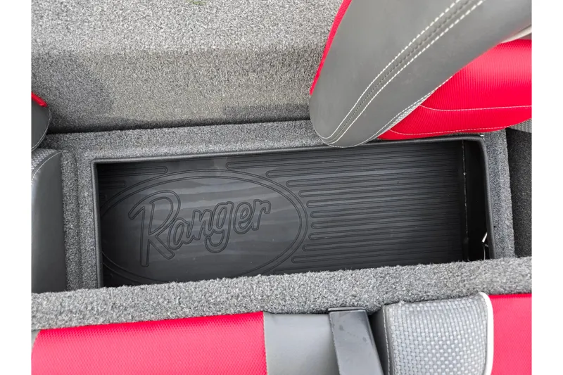 Slide: The Image of 2018 Ranger RT188C boat storage compartment with logo and red seats. - 21