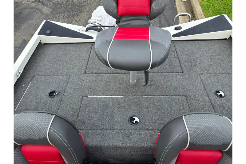 Slide: The Image of 2018 Ranger RT188C boat interior with red and gray seating and carpeted deck. - 22