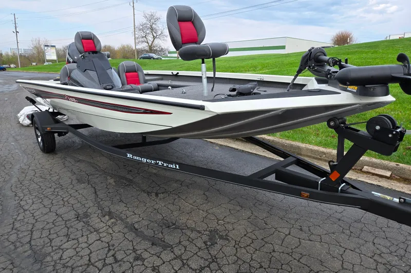 Slide: The Image of 2018 Ranger RT188C fishing boat on trailer, featuring sleek design and comfortable seating. - 5