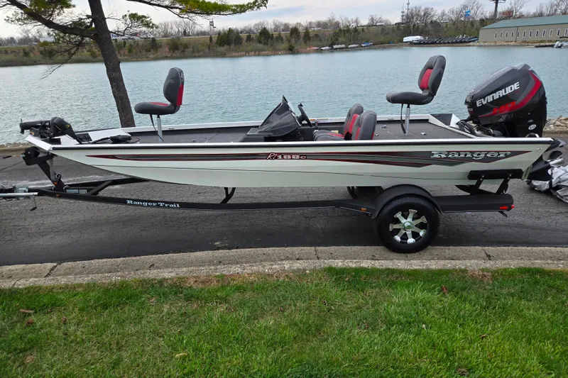 Slide: The Image of 2018 Ranger RT188C fishing boat on trailer by a lake. - 9
