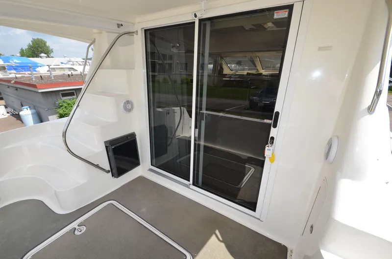 Slide: The Image of 2005 Sea Ray 420 Sedan Bridge with sliding door and exterior deck. - 13