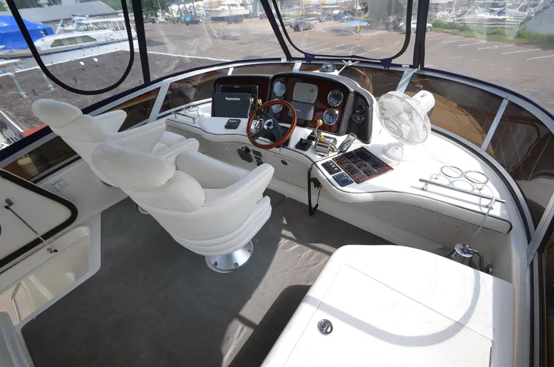 Slide: The Image of Interior of 2005 Sea Ray 420 Sedan Bridge, luxurious helm station. - 17