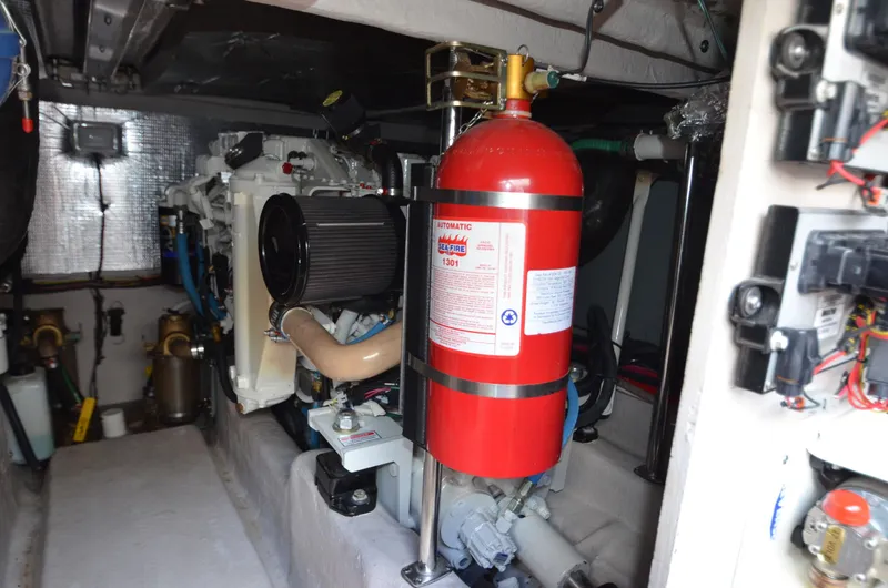 Slide: The Image of Engine room of 2005 Sea Ray 420 Sedan Bridge with fire extinguisher. - 20