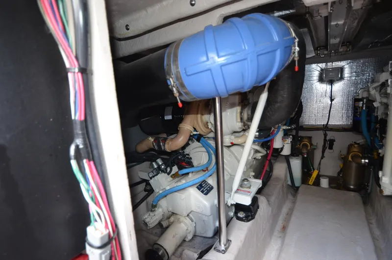 Slide: The Image of Engine room of 2005 Sea Ray 420 Sedan Bridge with blue cover. - 21