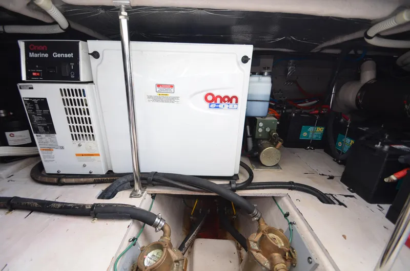 Slide: The Image of Onan marine generator in the engine room of 2005 Sea Ray 420 Sedan Bridge. - 23