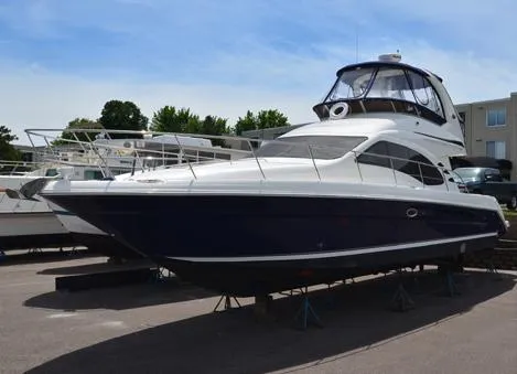 Slide: The Image of 2005 Sea Ray 420 Sedan Bridge on a parking lot. - 3