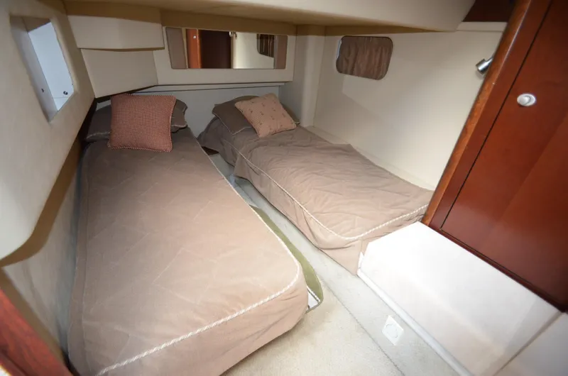 Slide: The Image of Interior of 2005 Sea Ray 420 Sedan Bridge with twin beds. - 4