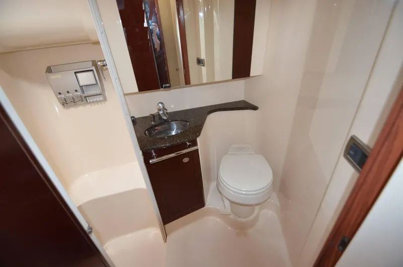 Slide: The Image of 2005 Sea Ray 420 Sedan Bridge bathroom with sink and toilet. - 5