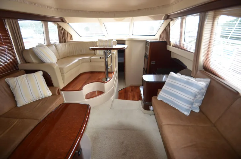 Slide: The Image of Interior of 2005 Sea Ray 420 Sedan Bridge with elegant seating area. - 6