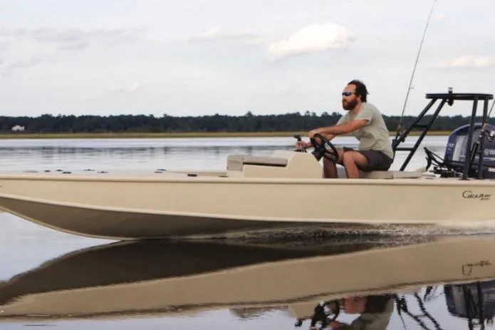 Slide: The Image of 2016 Cast and Blast Center Console boat cruising on calm water. - 3