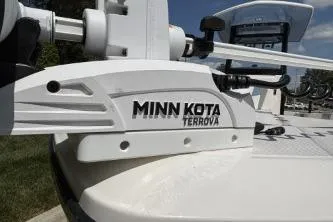 Slide: The Image of Minn Kota Terrova motor on 2025 Robalo 246 Cayman boat, sunny day. - 2