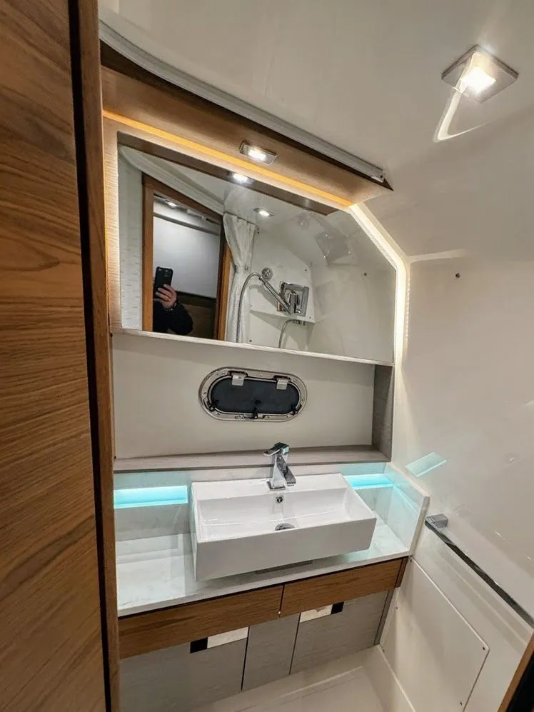 Slide: The Image of Luxurious bathroom of 2024 Tiara Yachts 38 LS with modern sink. - 10