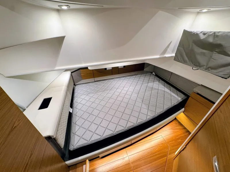 Slide: The Image of Interior of 2024 Tiara Yachts 38 LS featuring modern bed. - 12