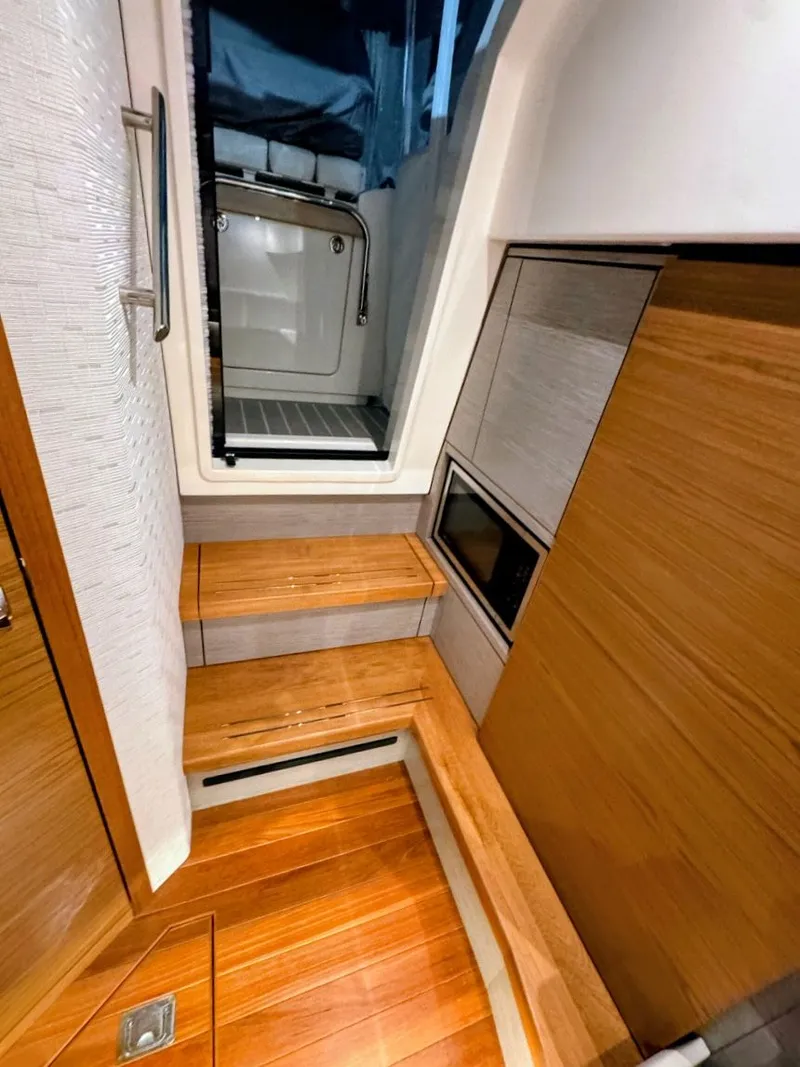 Slide: The Image of Interior of 2024 Tiara Yachts 38 LS with wood paneling. - 14