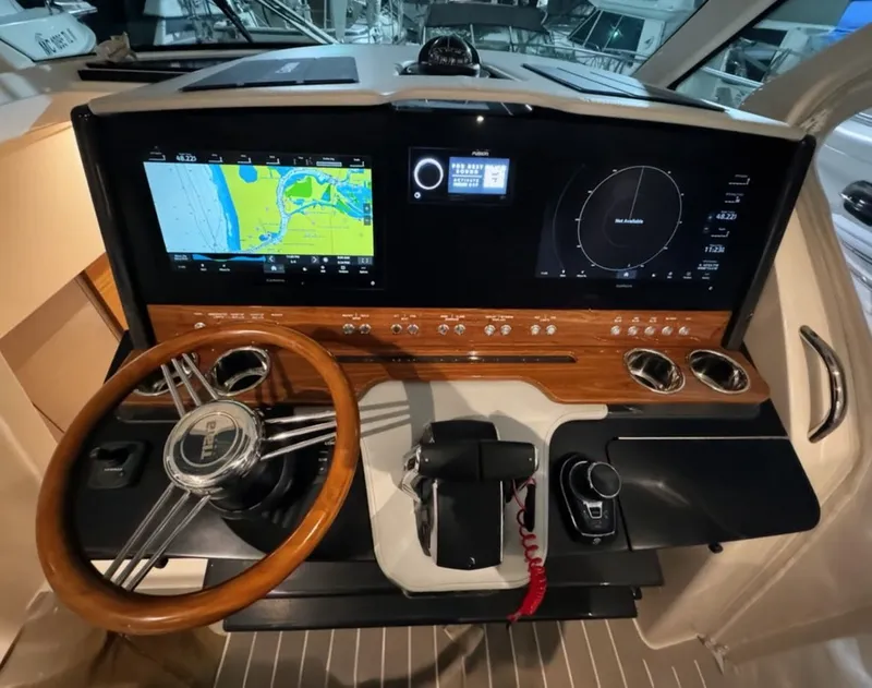 Slide: The Image of 2024 Tiara Yachts 38 LS cockpit with advanced navigation system. - 16