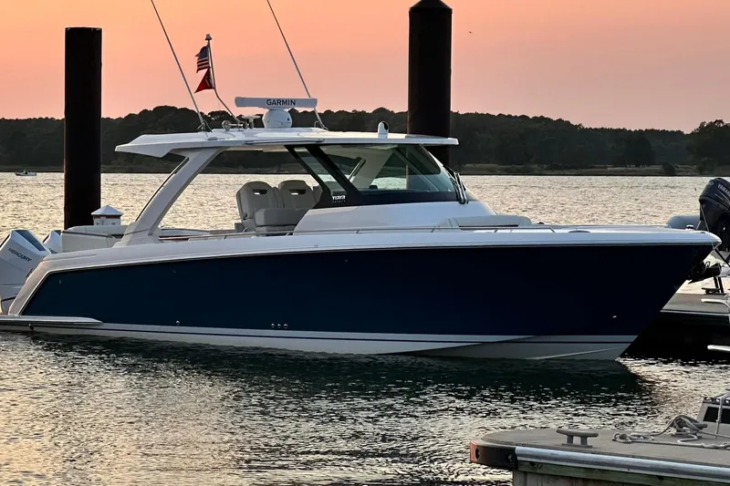 Slide: The Image of 2024 Tiara Yachts 38 LS docked at sunset. - 26