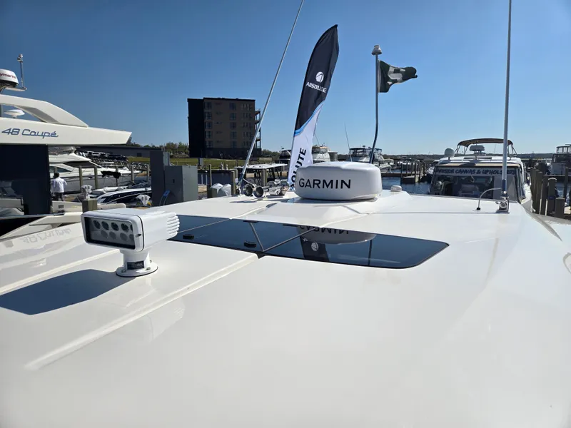Slide: The Image of 2024 Tiara Yachts 38 LS with Garmin equipment at the marina. - 32