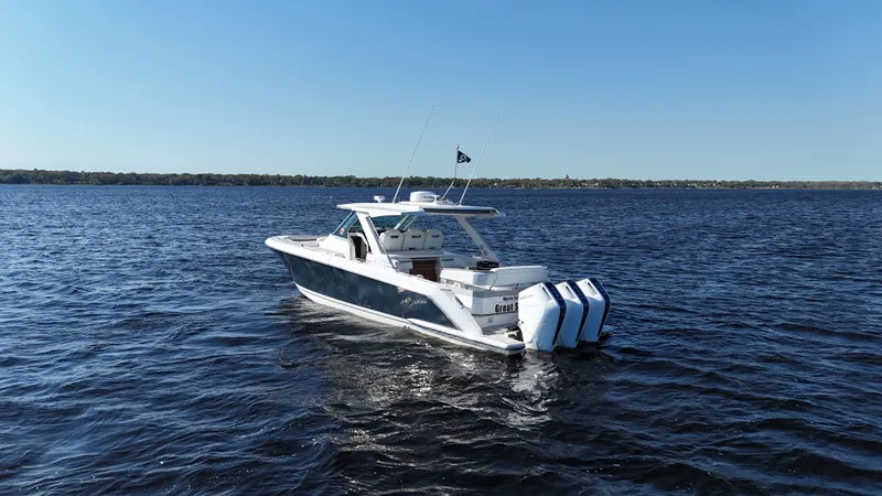 Slide: The Image of 2024 Tiara Yachts 38 LS on open water, rear view. - 33