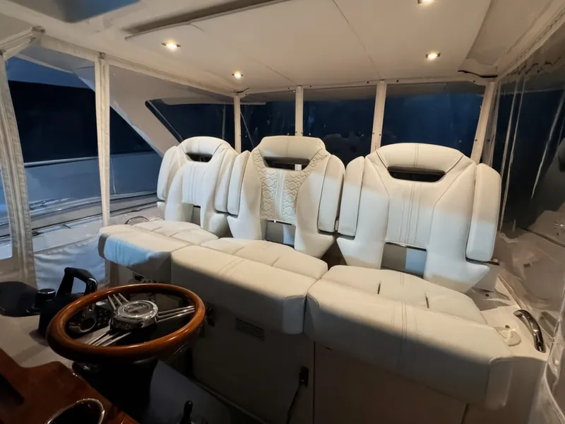 Slide: The Image of Interior of 2024 Tiara Yachts 38 LS with luxurious white seating. - 4