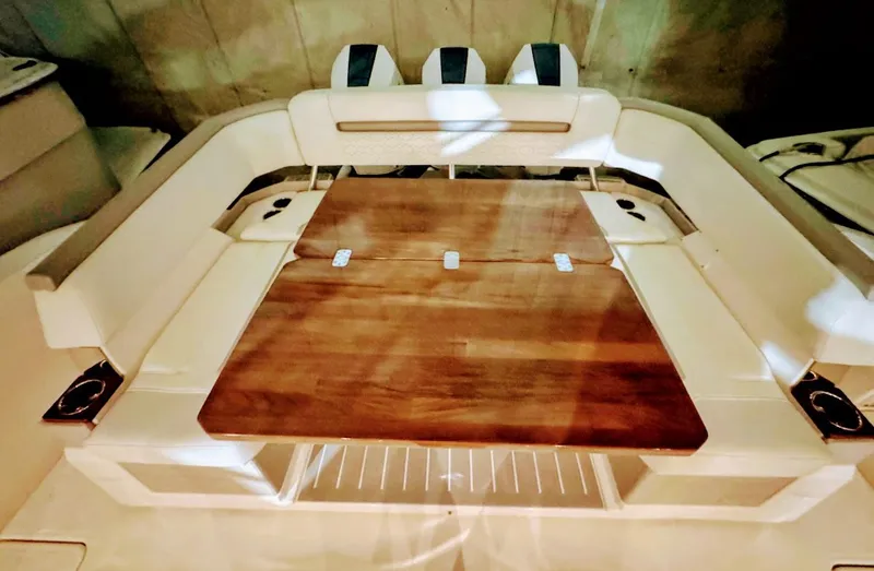 Slide: The Image of Interior of 2024 Tiara Yachts 38 LS with wooden table. - 5