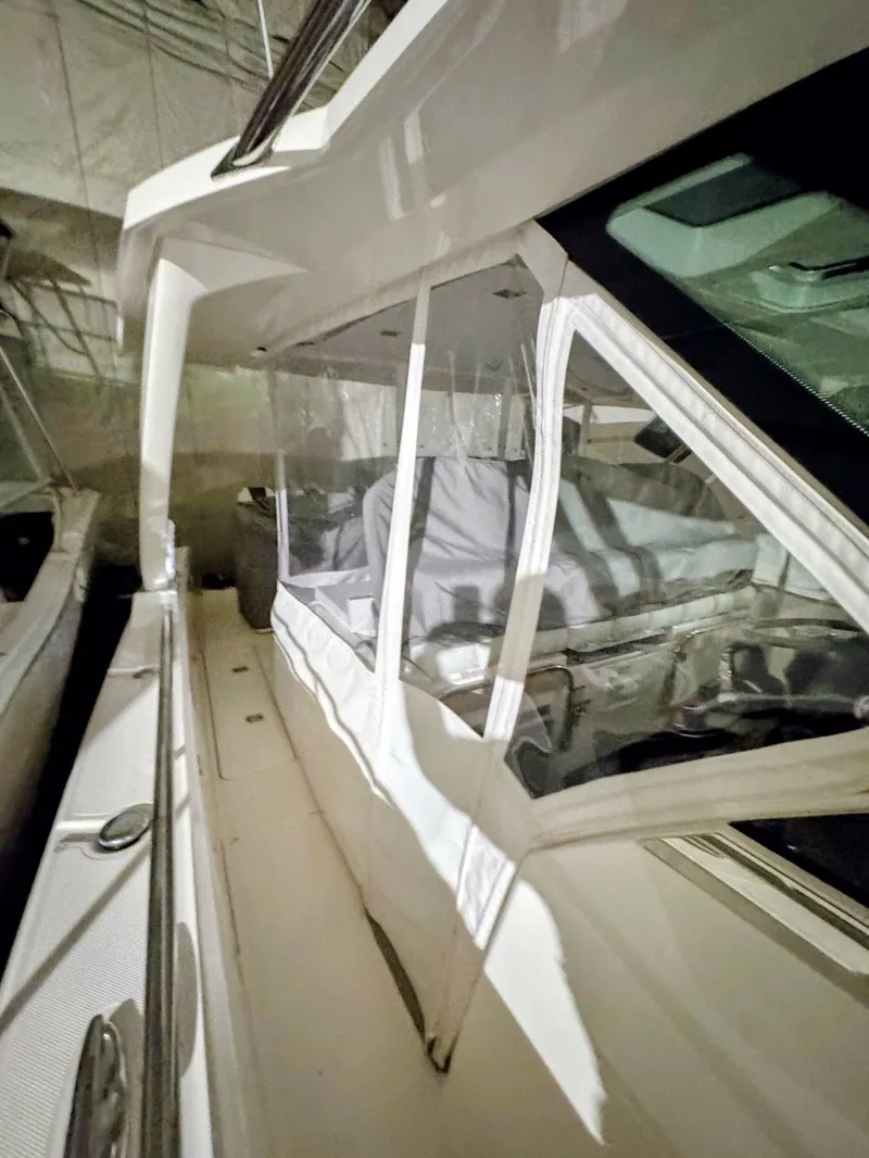 Slide: The Image of 2024 Tiara Yachts 38 LS with enclosed cabin in dock. - 7