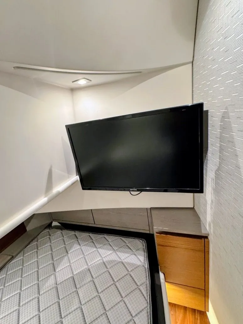 Slide: The Image of Interior of 2024 Tiara Yachts 38 LS with TV and bed. - 9