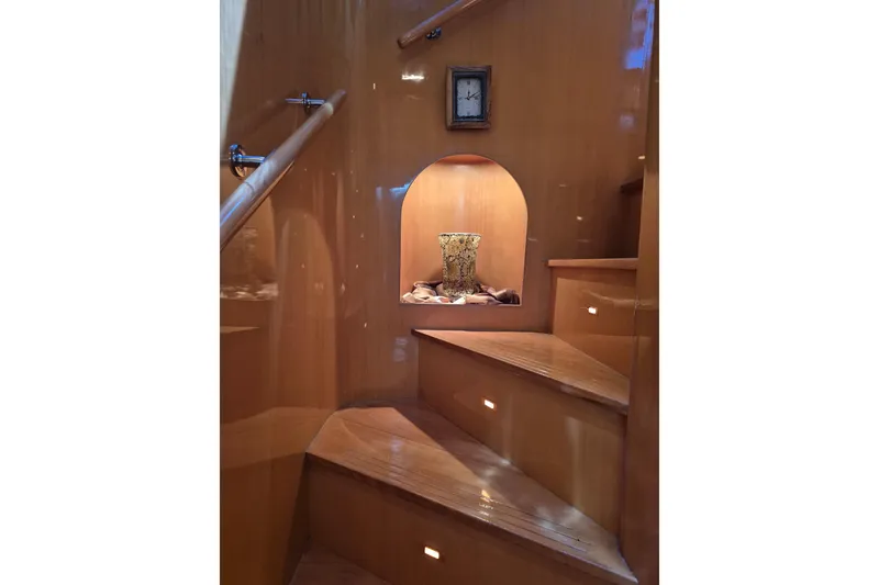 Slide: The Image of Wooden staircase with decorative vase and clock on 2006 Altima Flybridge yacht. - 15