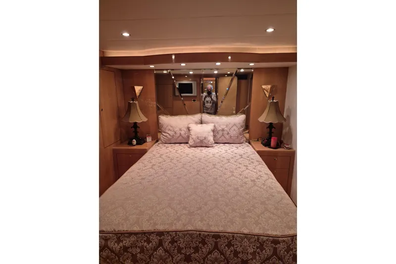 Slide: The Image of Luxurious bedroom interior of 2006 Altima Flybridge yacht with elegant bedding and ambient lighting. - 17