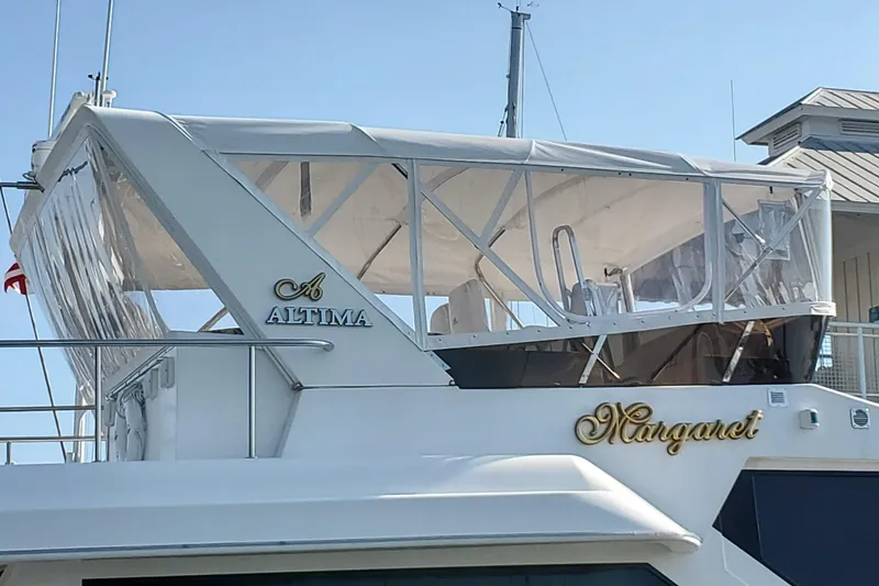 Slide: The Image of 2006 Altima Flybridge 76 yacht named "Margaret" with enclosed flybridge. - 2