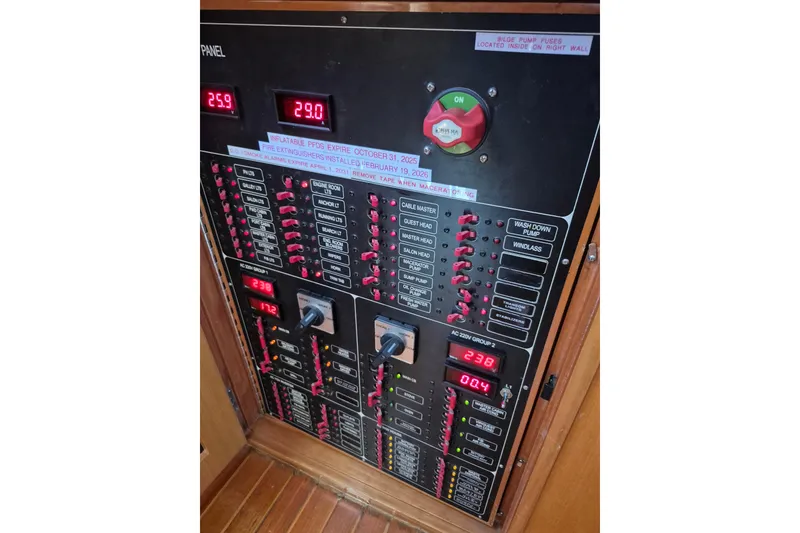 Slide: The Image of Electrical control panel on a 2006 Altima Flybridge boat, displaying various switches and readings. - 20
