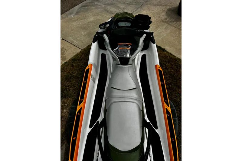 Slide: The Image of 2019 Sea-Doo FishPro 155 jet ski, top view, parked on concrete and grass. - 6