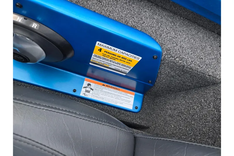 Slide: The Image of 2022 Vexus AVX2080 boat interior with capacity warning label. - 13