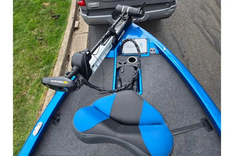 Slide: The Image of 2022 Vexus AVX2080 boat with Minn Kota motor and Garmin equipment, parked on street. - 18