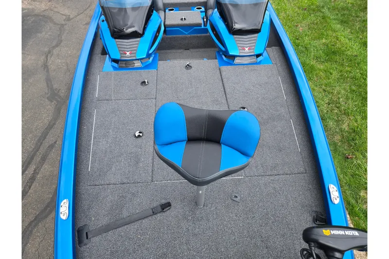 Slide: The Image of 2022 Vexus AVX2080 boat interior with blue and gray seating, featuring Minn Kota trolling motor. - 20