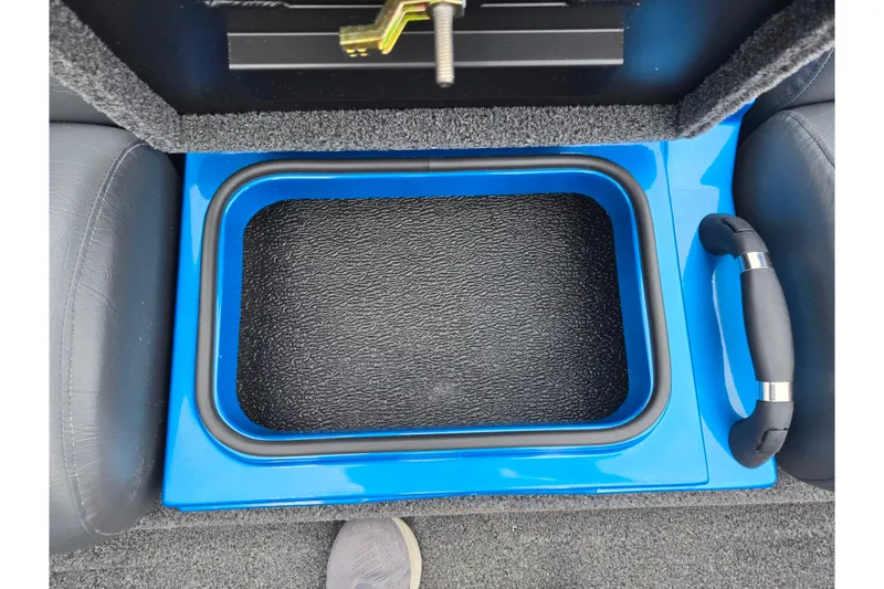 Slide: The Image of 2022 Vexus AVX2080 boat interior with blue storage compartment and handle. - 23