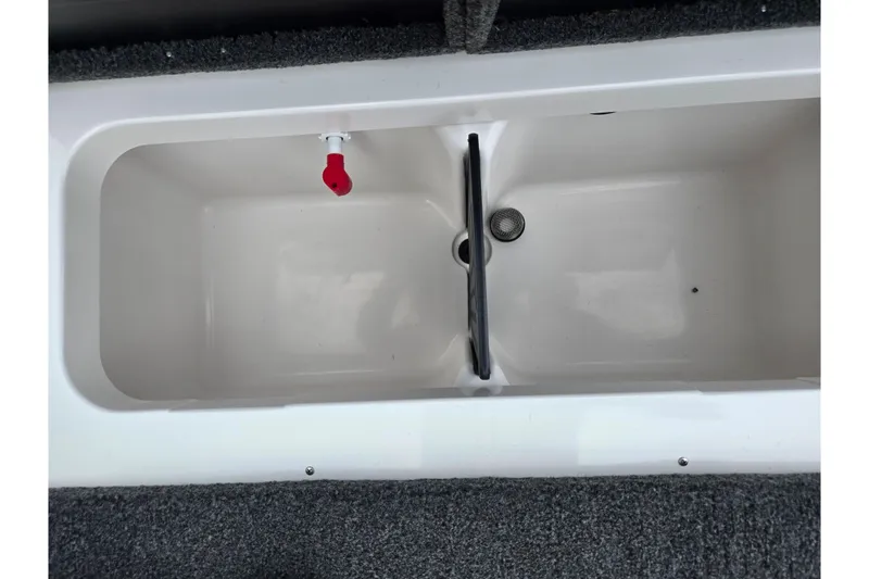 Slide: The Image of 2022 Vexus AVX2080 livewell interior with red nozzle and drain. - 25