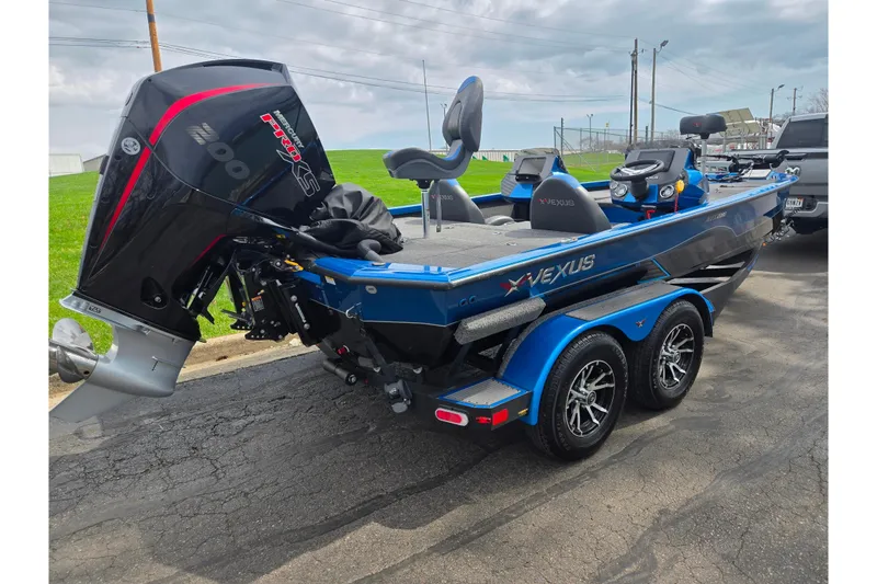 Slide: The Image of 2022 Vexus AVX2080 boat with powerful engine, sleek design, and dual-axle trailer. - 3