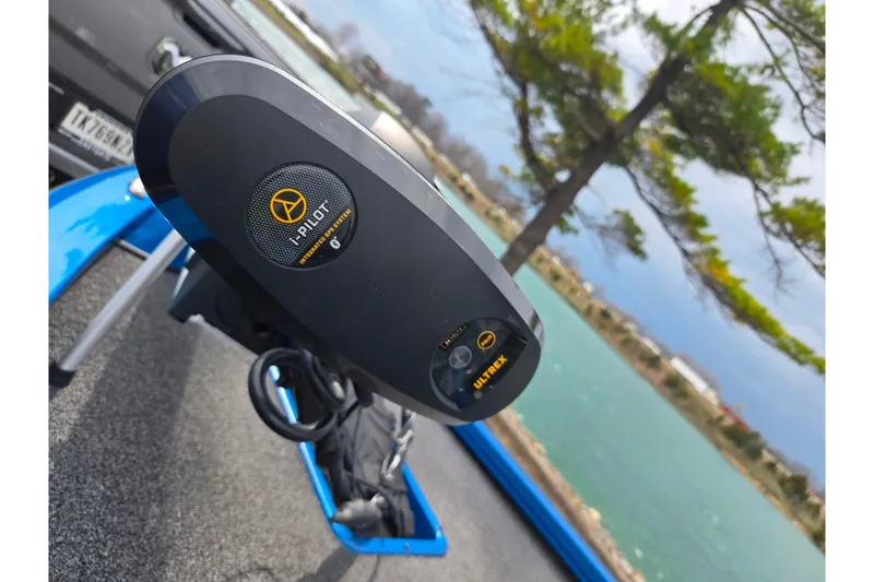 Slide: The Image of 2022 Vexus AVX2080 boat with i-Pilot Ultrex trolling motor by a scenic lake. - 8