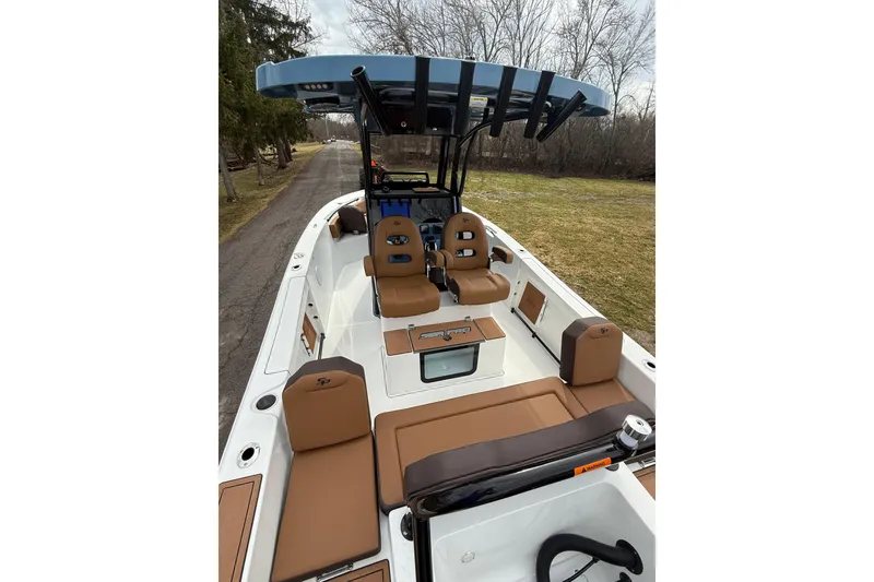 Slide: The Image of 2026 Sea Pro 245FLXR Sandbar boat with tan seating and sleek design. - 11