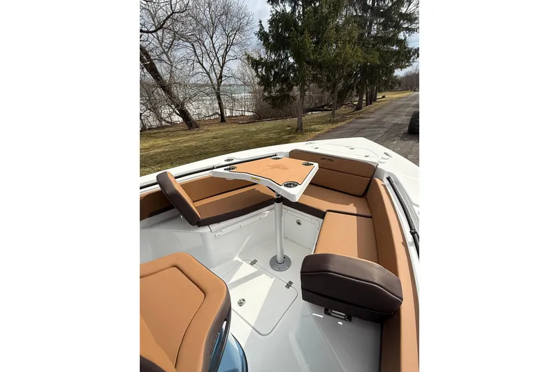 Slide: The Image of 2026 Sea Pro 245FLXR Sandbar boat interior with tan seating and table. - 13