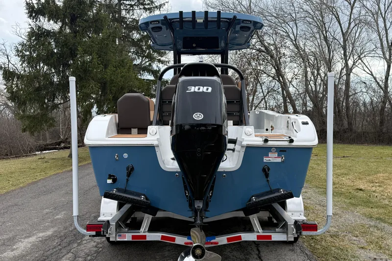 Slide: The Image of 2026 Sea Pro 245FLXR Sandbar boat on trailer, rear view with outboard motor. - 4