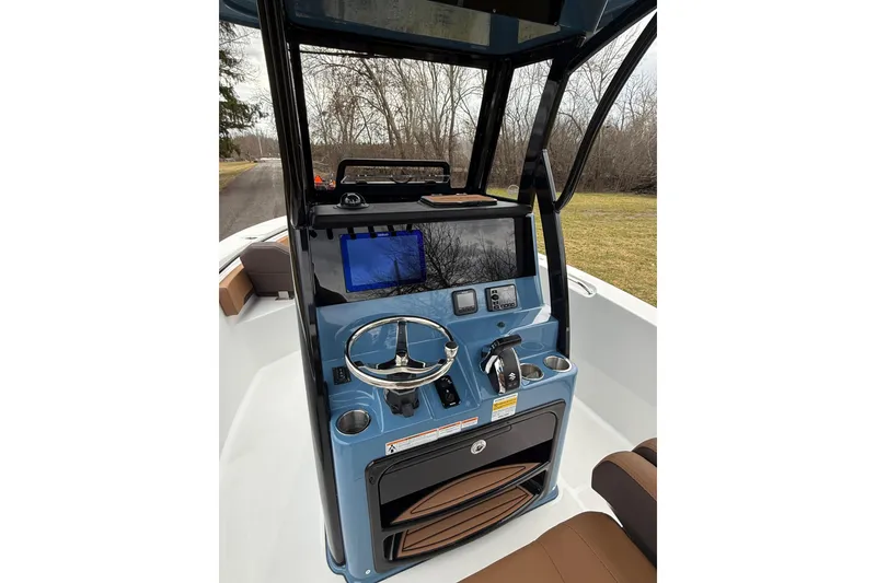 Slide: The Image of 2026 Sea Pro 245FLXR Sandbar boat console with steering wheel and navigation display. - 7