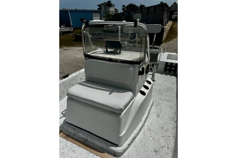 Slide: The Image of 2007 Haynie 23 Bigfoot boat console with seating and steering controls. - 12